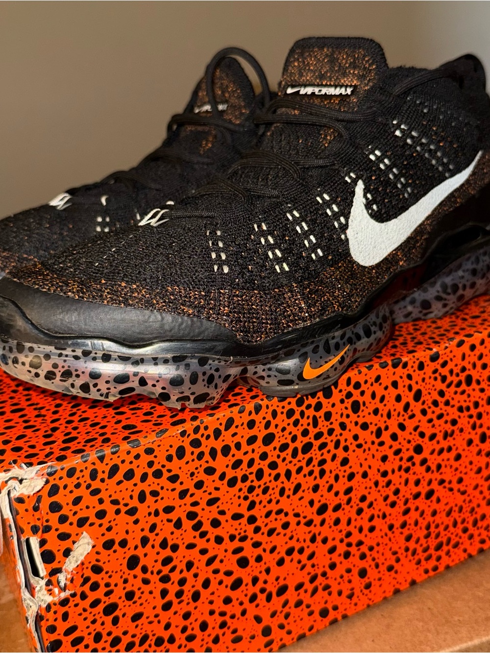 Nike Black Flyknit VaporMax with White Swoosh and Orange Details
